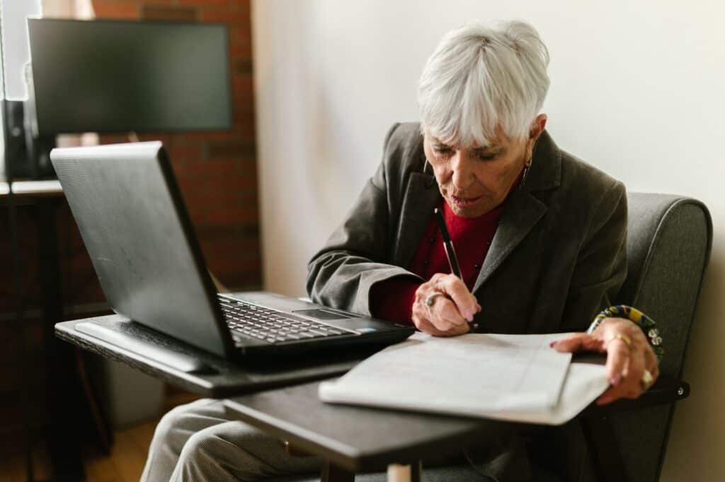  An older woman studying. Is It Too Late to Change Careers