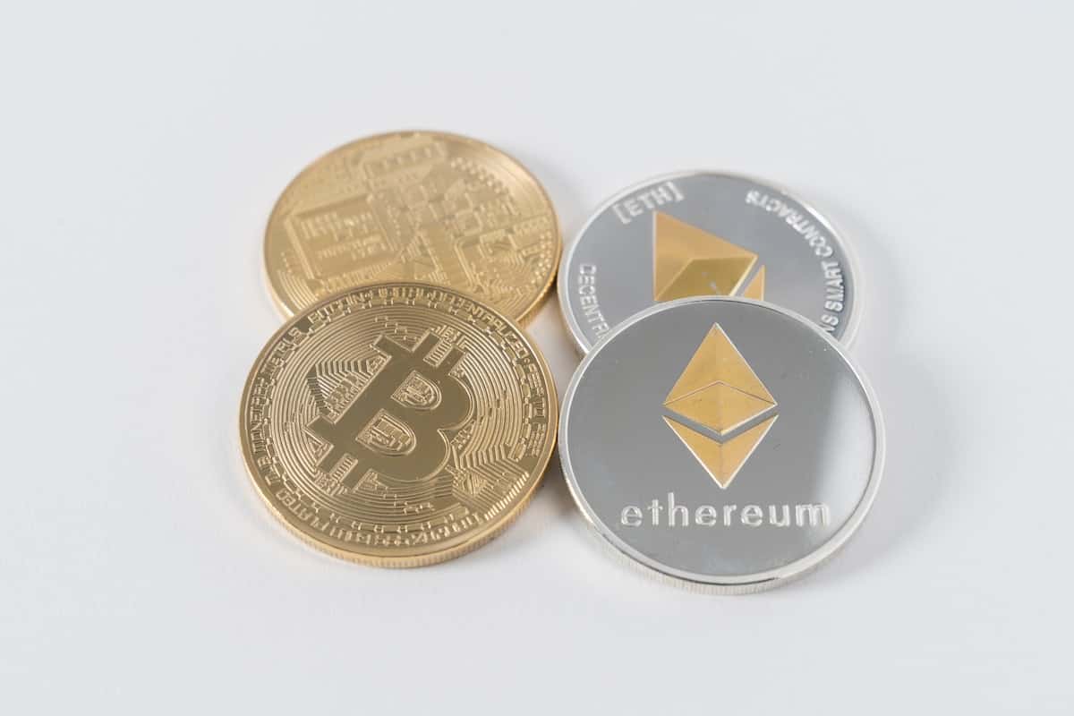 Pieces of Ethereum and Bitcoin sitting side by side.