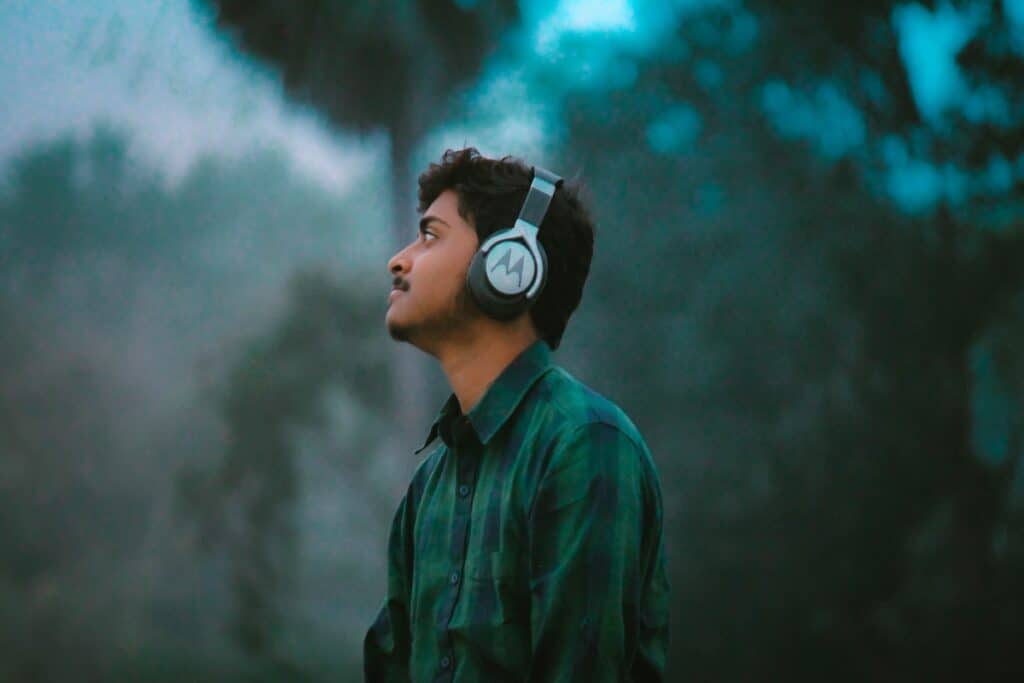 A young man wearing headphones