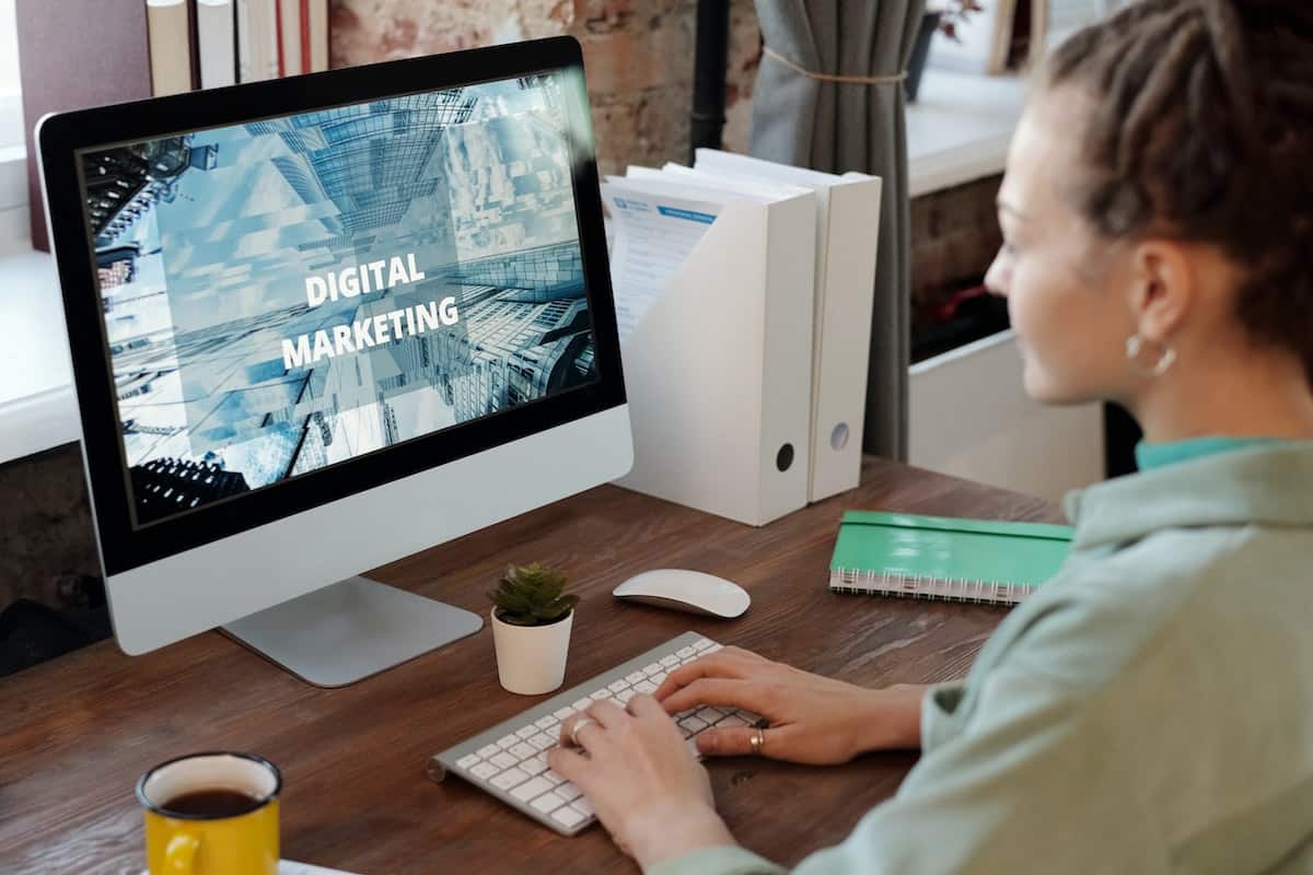 Woman at a desk practicing digital marketing